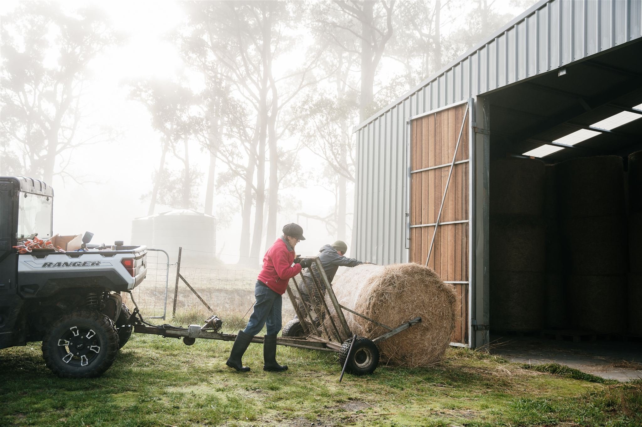 Moving hay bales on farm