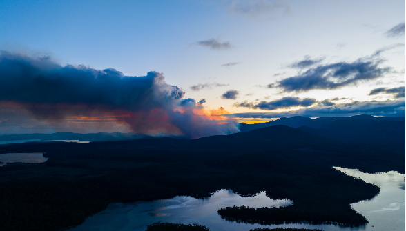 Landscape with fire burning in the distance